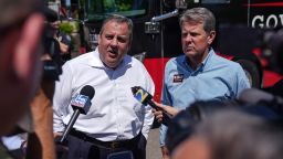Former New Jersey Gov. Chris Christie (L) and Gov. Brian Kemp talk to the media at a campaign event on May 17, 2022 in Canton, Georgia. Kemp touted a one-time tax refund included in the state budget he signed last week on a statewide bus tour to meet and talk with voters ahead of the May 24 primary.  (Photo by Elijah Nouvelage/Getty Images)