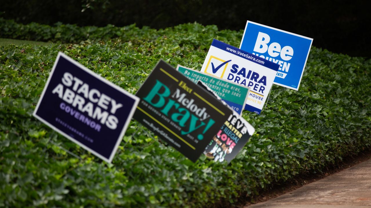 Campaign signs are seen in a yard in Atlanta.