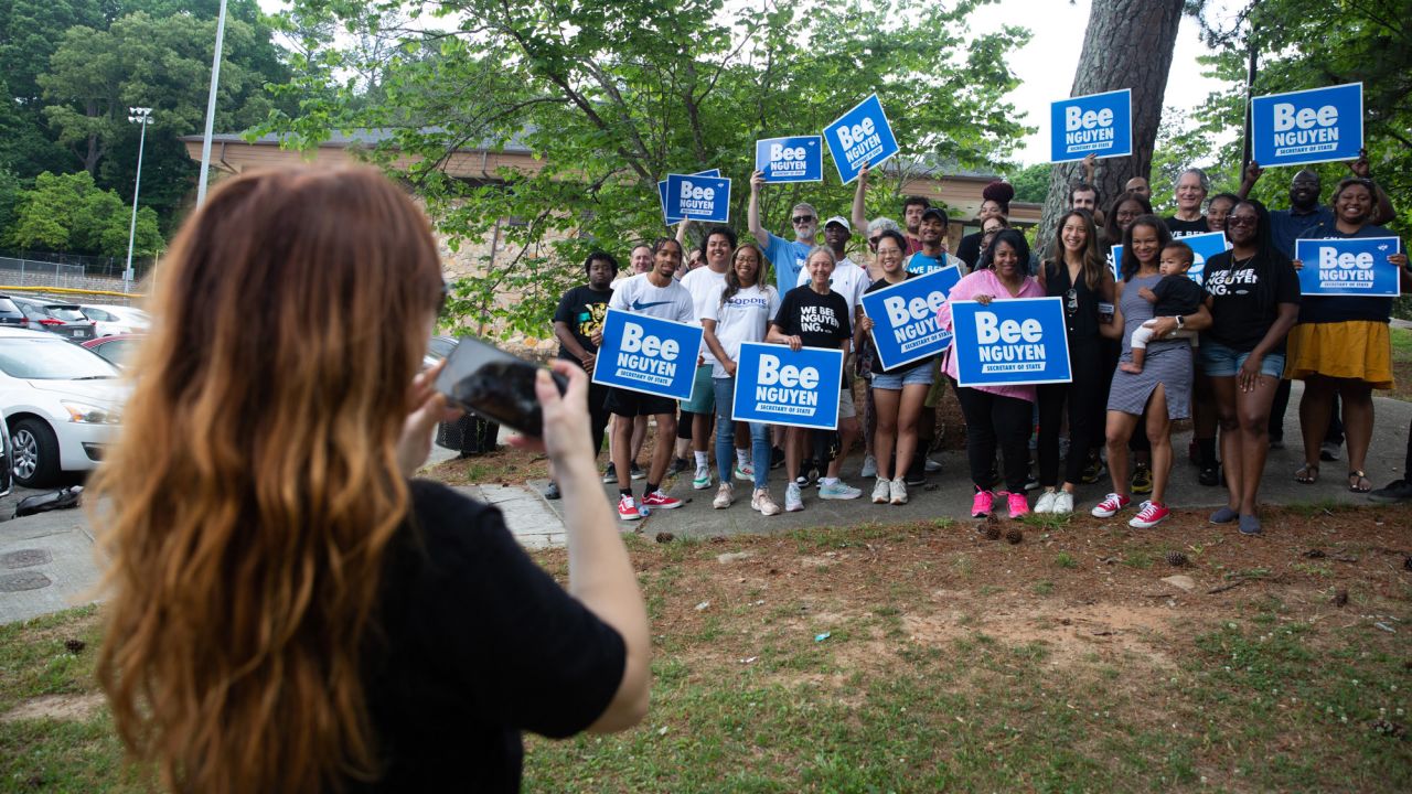 Campaign volunteers take a photo with Nguyen.