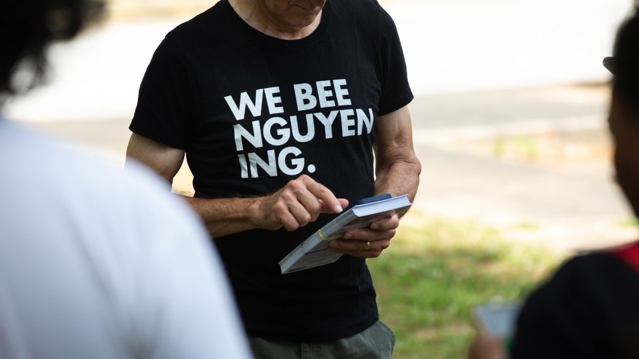 A volunteer wears a campaign shirt. Nguyen is pronounced "win."