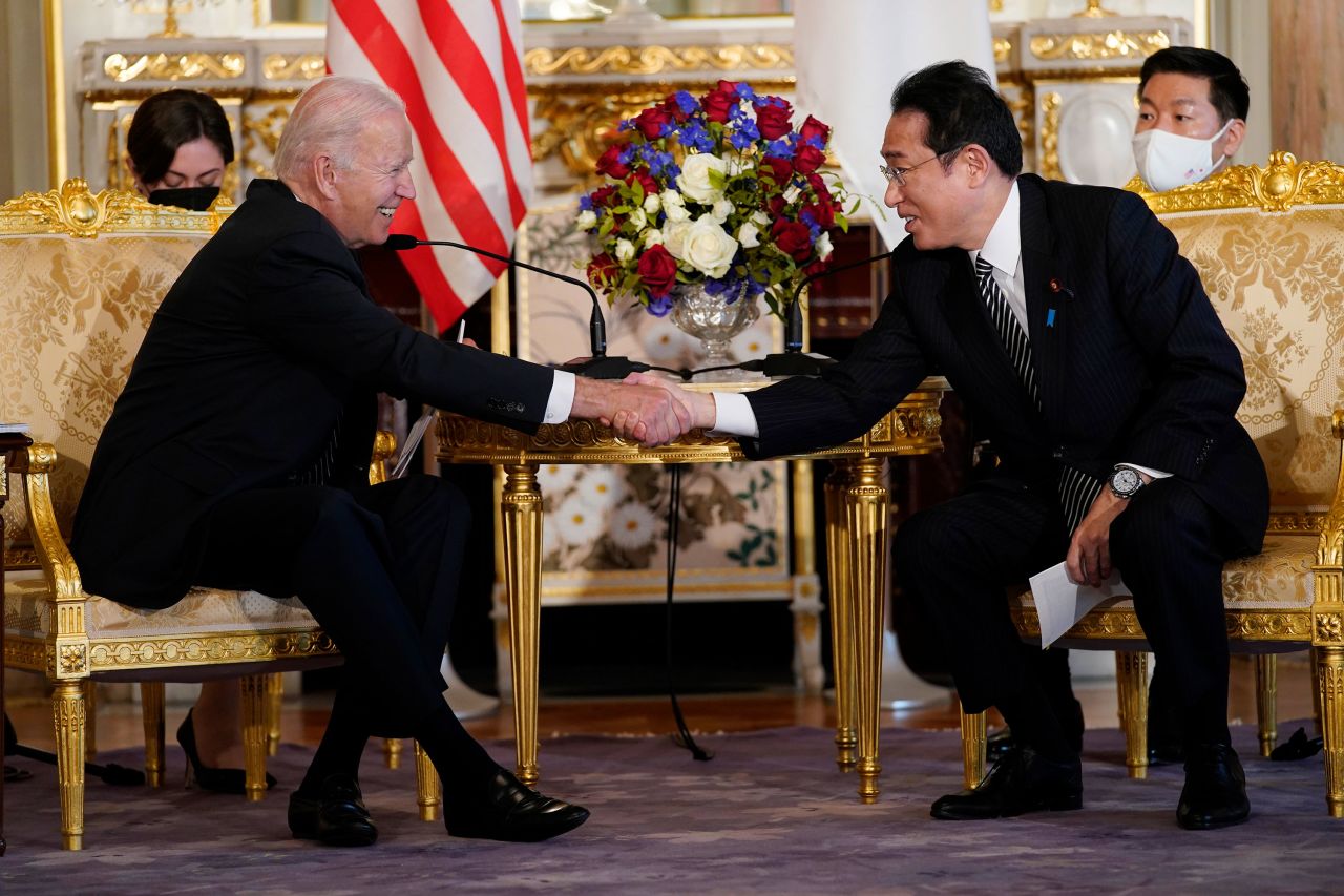 Biden shakes hands with Kishida during a bilateral meeting at Tokyo's Akasaka Palace.