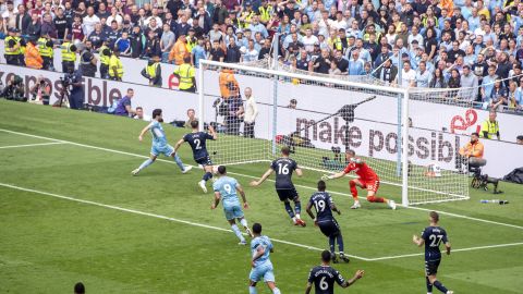 Manchester City's Ilkay Gundogan scores his side's third goal against Aston Villa.