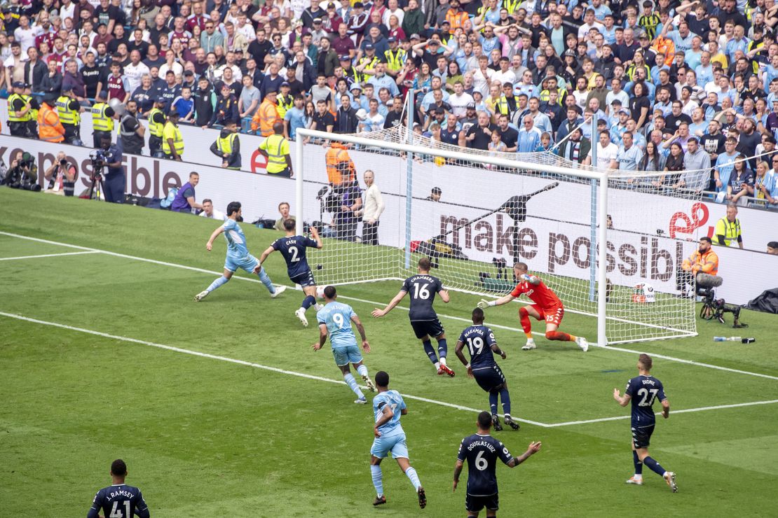 Manchester City's Ilkay Gundogan scores his side's third goal against Aston Villa.