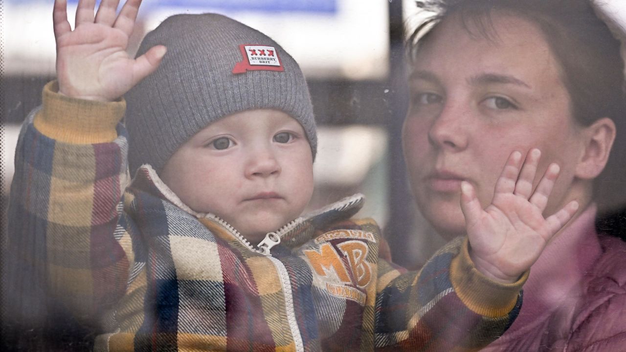 MEDYKA, POLAND - MARCH 30: People, mainly women and children, make their way through Medyka border crossing after journeying from war-torn Ukraine on March 30, 2022 in Medyka, Poland. The Polish government has said it may spend €24 billion this year hosting refugees fleeing the war in Ukraine, and is seeking more support from the European Union. With more than 2.3 million Ukrainian refugees, Poland is now the country with the second-largest foreign refugee population after Turkey. (Photo by Jeff J Mitchell/Getty Images)