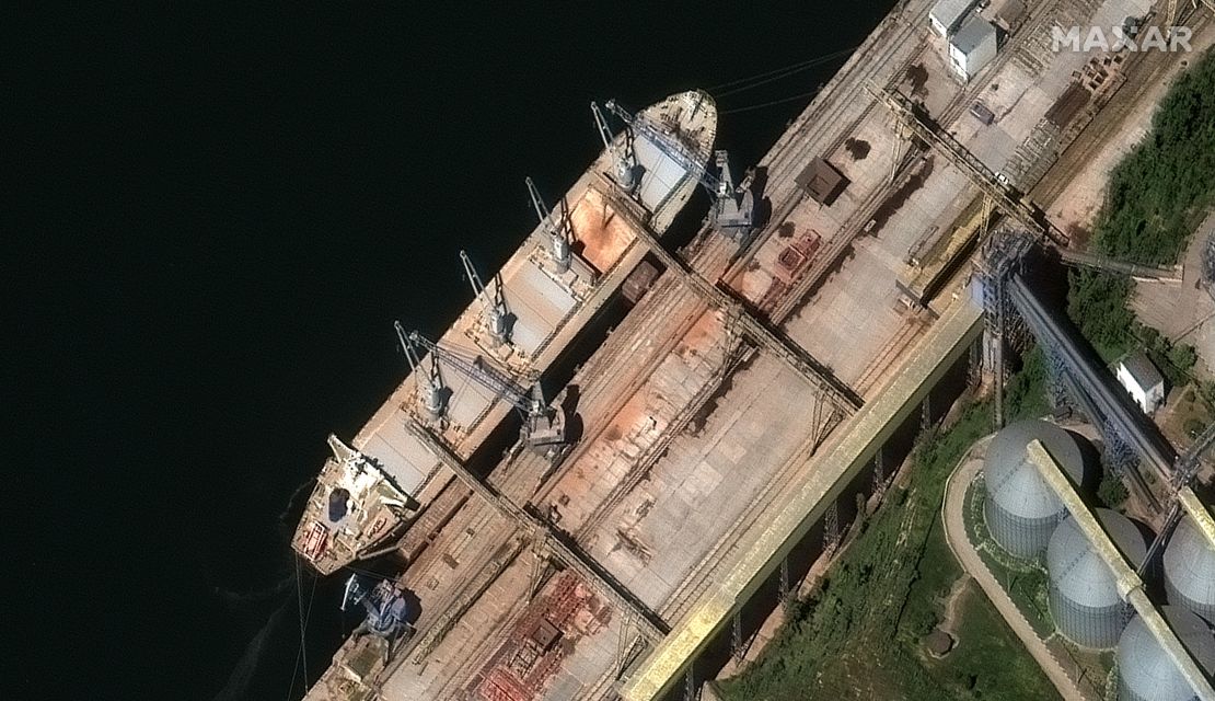 A satellite image from Maxar technologies shows grain being loaded into the hull of the Russia-flagged ship Matros Pozynich in Crimea
