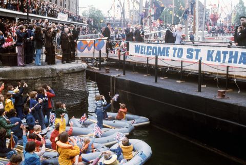 A rousing welcome for Queen Elizabeth II at St Katharine's Dock near the Tower of London, one of the stops on her Silver Jubilee river progress from Greenwich to Lambeth.   (Photo by Ron Bell/PA Images via Getty Images)