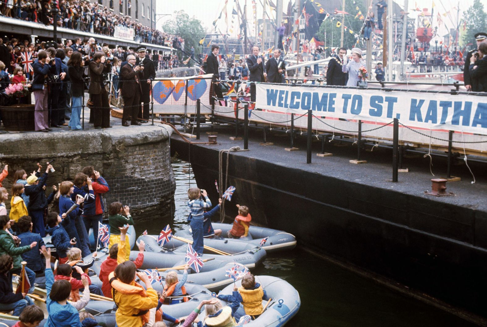 The Queen is welcomed at St. Katharine's Dock near the Tower of London during her Silver Jubilee.