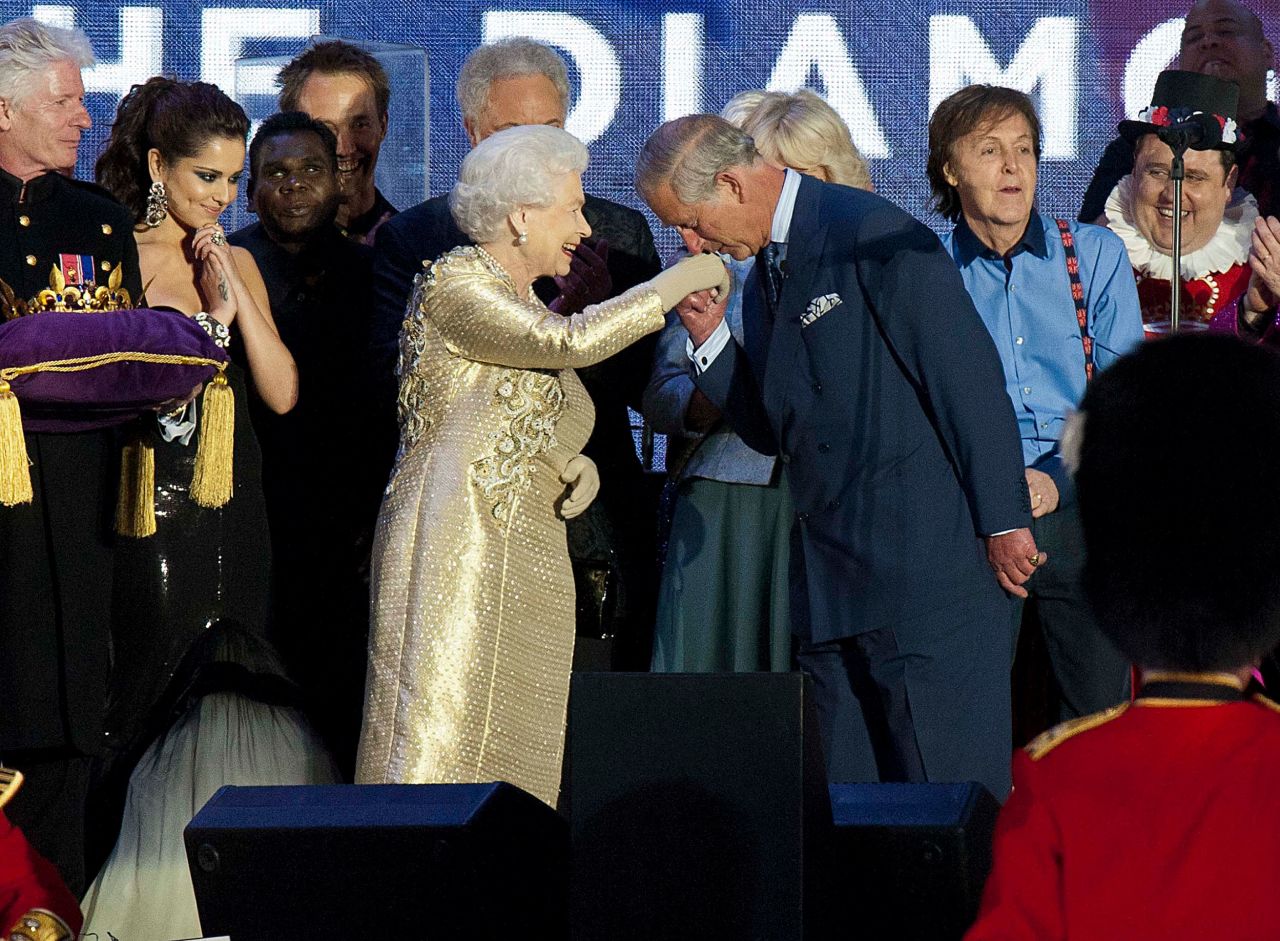 Paul McCartney and Cheryl Cole were among the stars to share a stage with the Queen during the Diamond Jubilee Concert, where Prince Charles greeted his mother with a kiss on the hand.