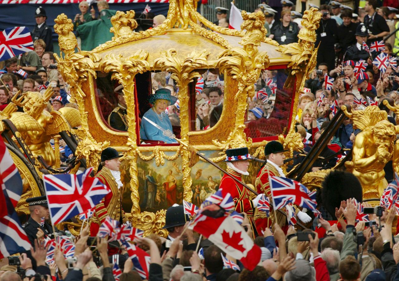 Royal-watchers young and old gather to catch a glimpse of the royal couple in the horse-drawn Gold State Coach, which was built in 1762.