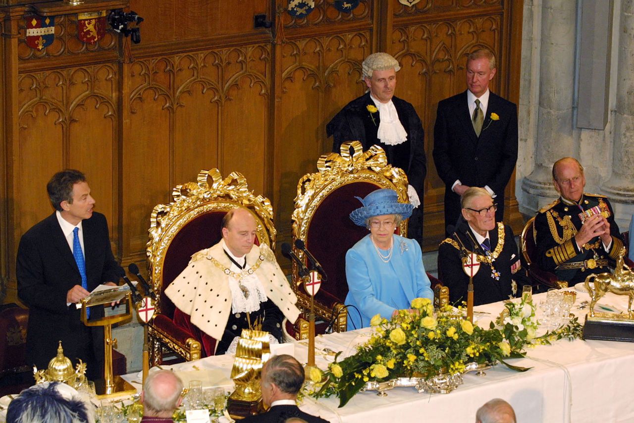 Britain's Prime Minister Tony Blair, left, delivers a speech praising the Queen's commitment to others and describes the "huge affection" in which the nation holds her during a celebratory lunch at the Guildhall on June 4, 2002.