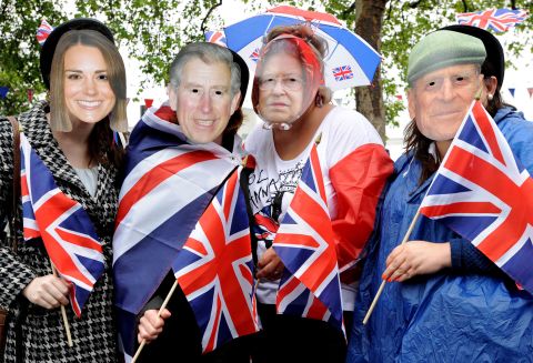 Royal fans flocked to the Thames river on June 3, 2012, to catch a glimpse of the Queen aboard a ceremonial barge at the center of a 1,000-boat pageant to mark her Diamond Jubilee.