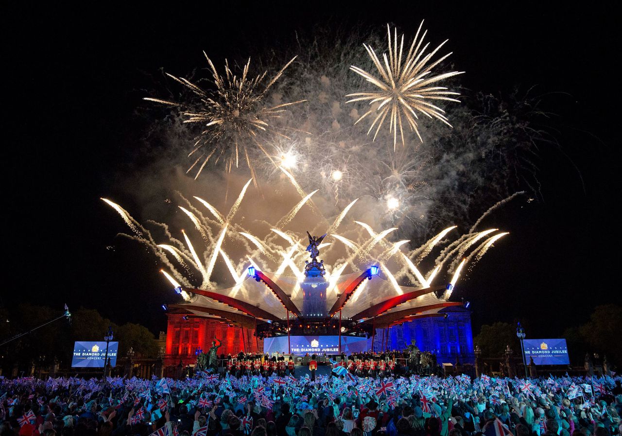 Fireworks light up the palace during a star-studded Diamond Jubilee concert organized by Take That singer and songwriter Gary Barlow. The Queen made a regal appearance but without Prince Philip, who <del> </del>was <a href="https://edition.cnn.com/2012/06/09/world/europe/uk-prince-philip/index.html" target="_blank">hospitalized</a> just hours earlier. 