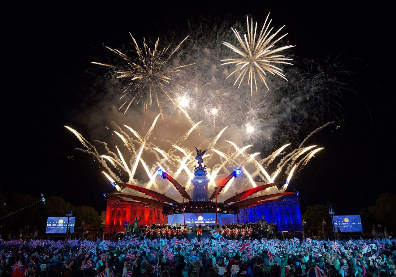 Fireworks light up the palace during a star-studded Diamond Jubilee concert organized by Take That singer and songwriter Gary Barlow. The Queen made a regal appearance but without Prince Philip, who <del> </del>was <a href="https://edition.cnn.com/2012/06/09/world/europe/uk-prince-philip/index.html" target="_blank">hospitalized</a> just hours earlier.