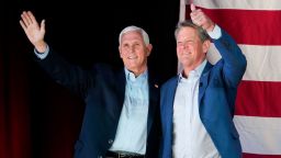 Former Vice President Mike Pence, left, and Georgia Gov. Brian Kemp, right, greet the crowd during a Get Out the Vote Rally, on Monday, May 23, 2022, in Kennesaw, Ga. Pence is opposing former President Donald Trump and his preferred Republican candidate for Georgia governor, former U.S. Sen. David Perdue.