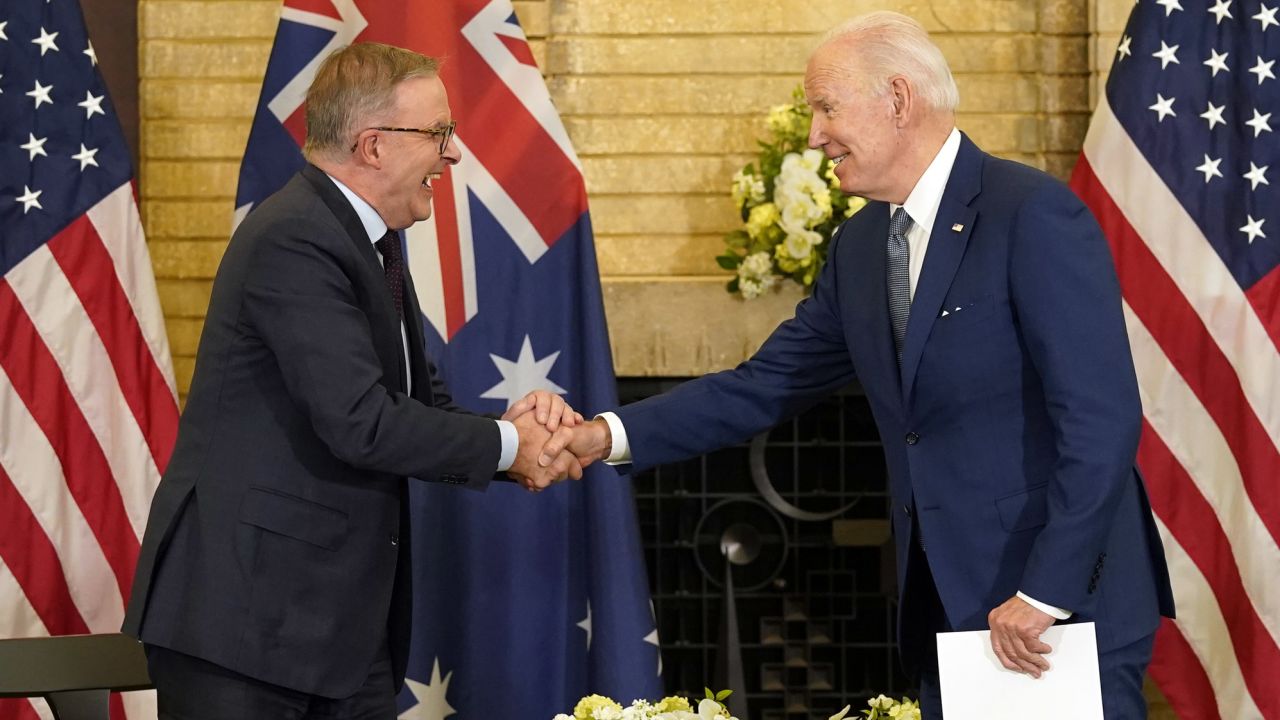 President Joe Biden, right, shakes hands with Australian Prime Minister Anthony Albanese during the Quad summit  in Tokyo.