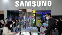 Visitors try out Samsung Electronics Galaxy smartphones during the 2022 World IT show at the Convention and Exhibition center in Seoul, South Korea, Wednesday, April 20, 2022. (AP Photo/Ahn Young-joon)