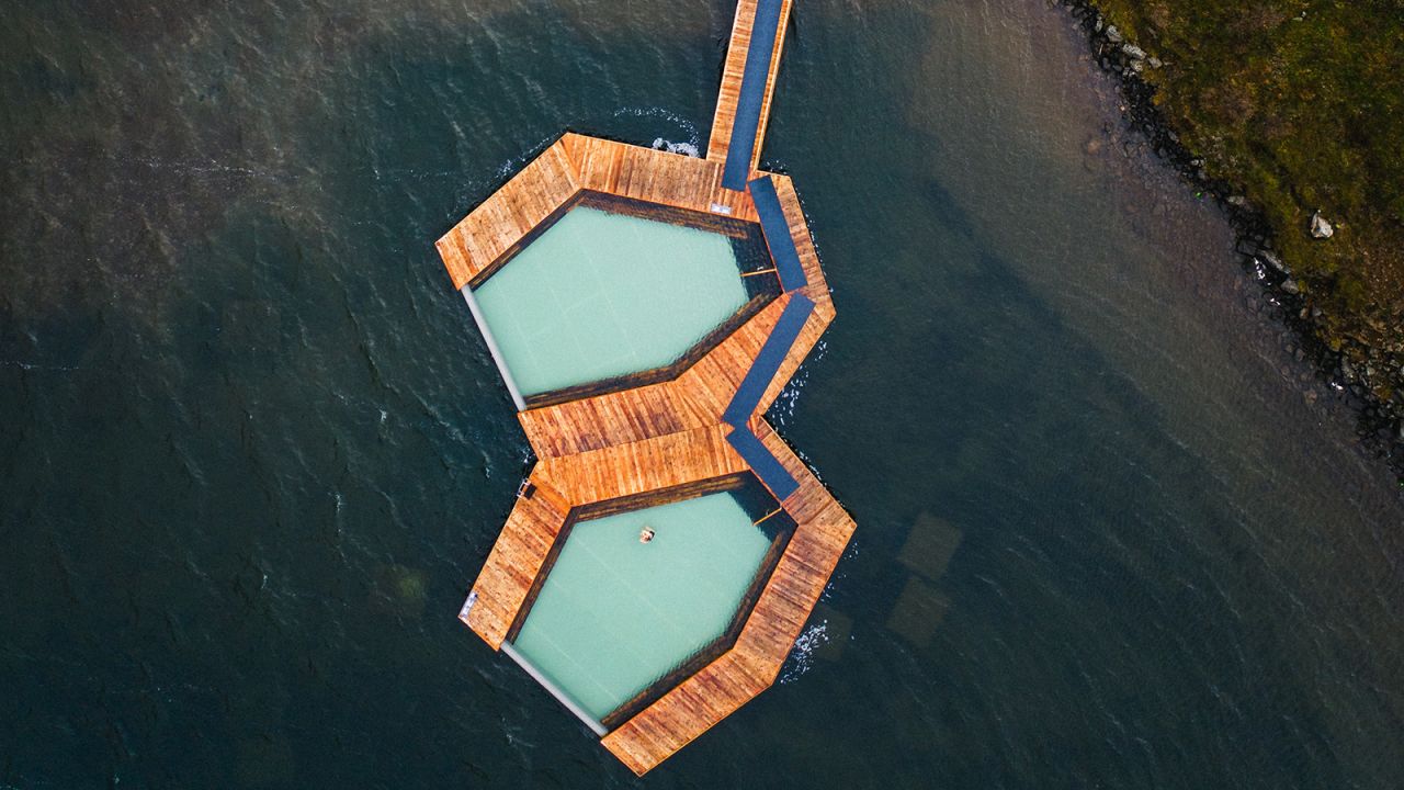 The pools at Vok float on a lake.