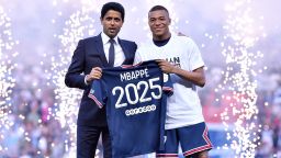 PARIS, FRANCE - MAY 21: Kylian Mbappé poses with PSG President, Nasser Al-Khelaifi after extending his contract with the PSG prior to the Ligue 1 Uber Eats match between Paris Saint Germain and FC Metz at Parc des Princes on May 21, 2022 in Paris, France.  (Photo by Aurelien Meunier - PSG/PSG via Getty Images)