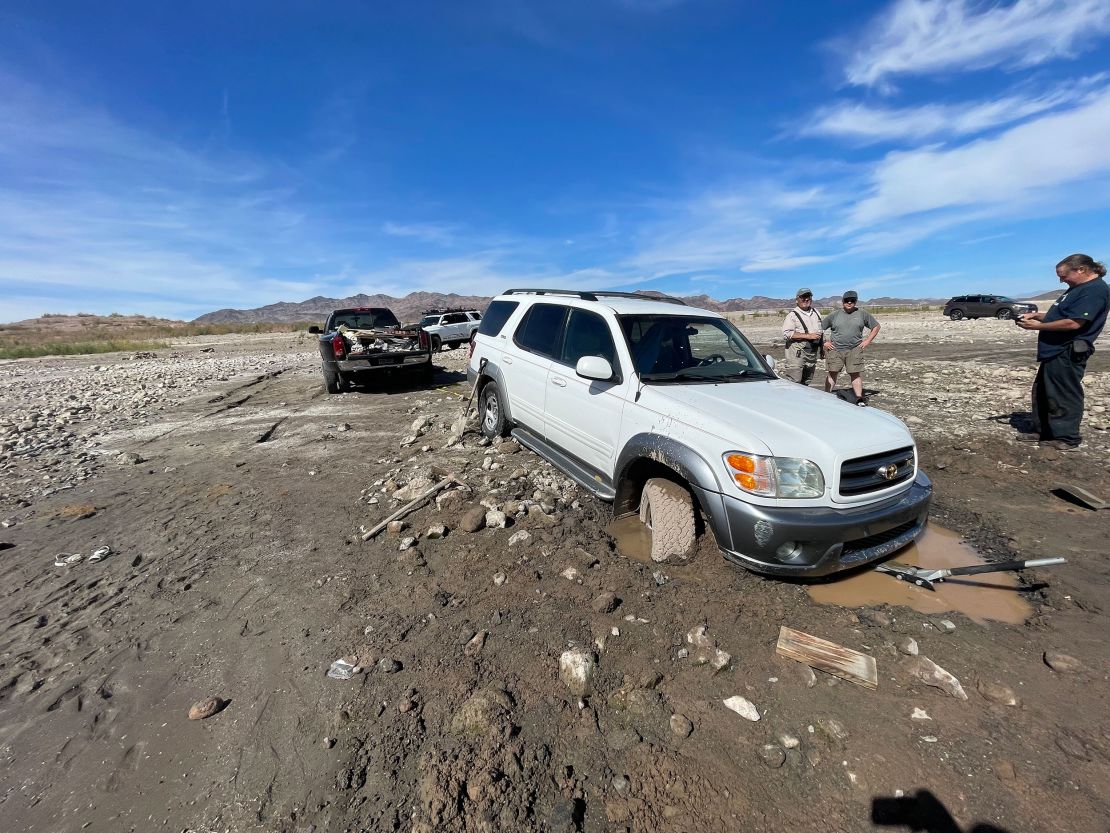 As the shoreline has receded, it's left behind a bank of mud that looks deceivingly stable.