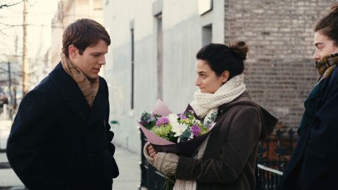 Jenny Slate (center, holding a bouquet) anchors "Obvious Child," a rom-com in which her protagonist has an abortion and makes a romantic connection.