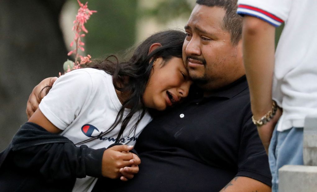 People react outside the Uvalde civic center on May 24.