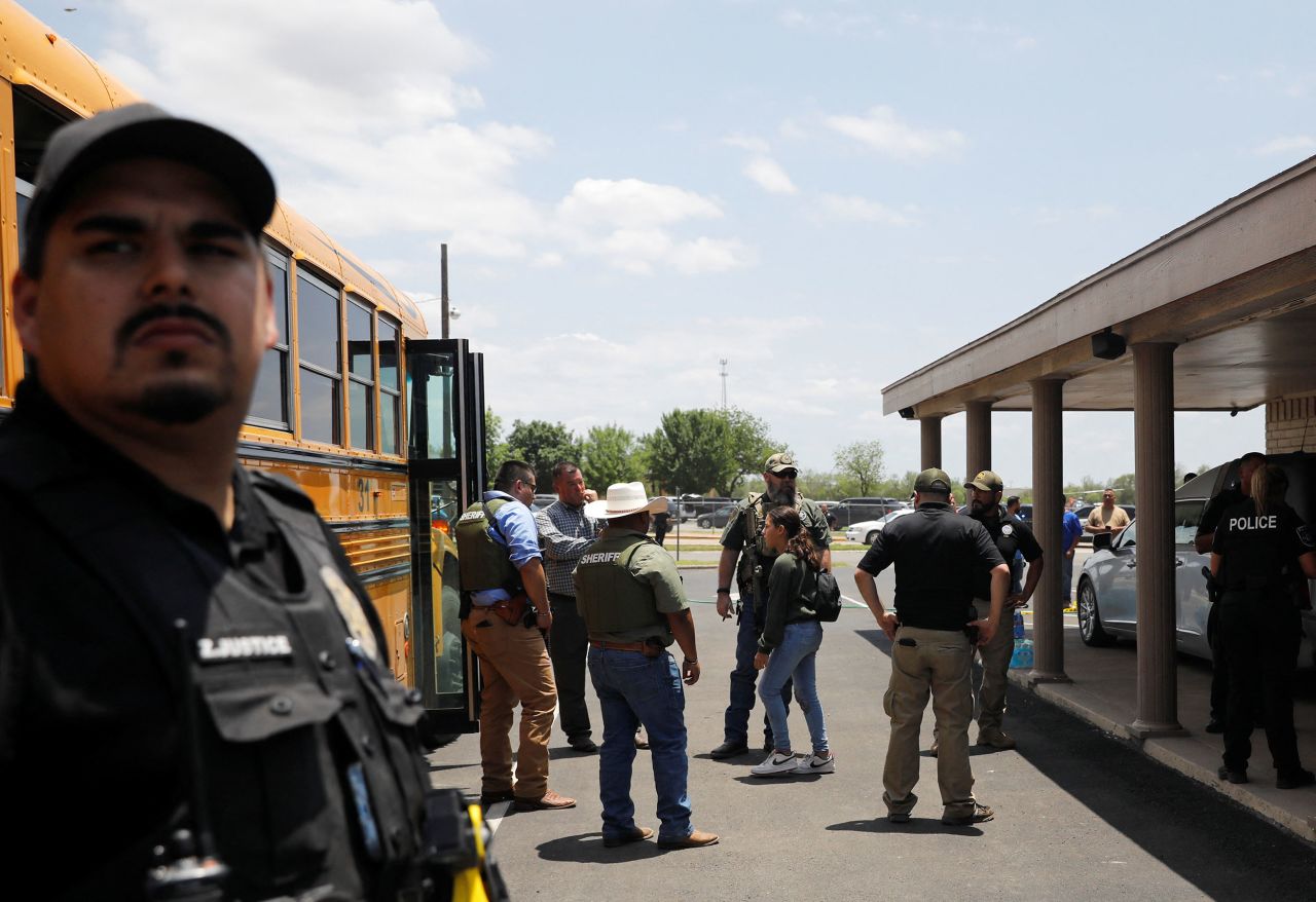 A child gets on a school bus under the watch of law enforcement on May 24. Robb Elementary teaches second through fourth grades and had 535 students in the 2020-21 school year, according to state data. About 90% of students are Hispanic and about 81% are economically disadvantaged, the data shows.