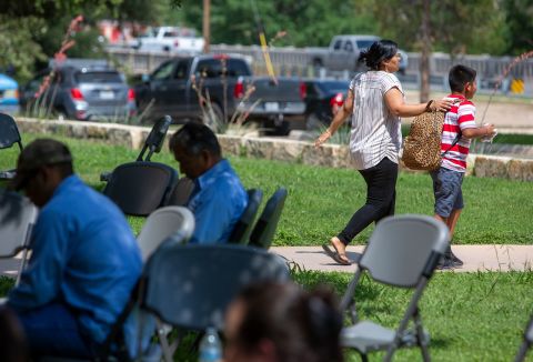 A woman and a child leave the Uvalde civic center on May 24.