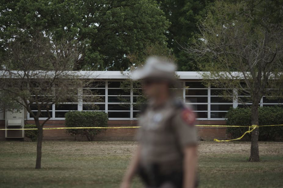 A Texas state trooper walks outside the school on May 24.