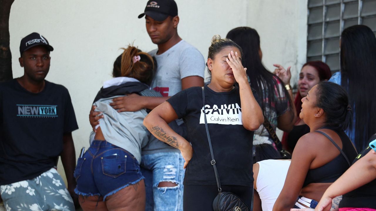 Relatives of those injured or killed during the raid in Rio de Janeiro's Vila Cruzeiro neighborhood wait outside the Getulio Vargas Hospital on Tuesday.
