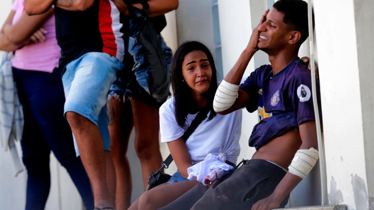 An injured person cries after being treated at Getulio Vargas Hospital after a police raid in Vila Cruzeiro, Rio de Janeiro, on Tuesday.