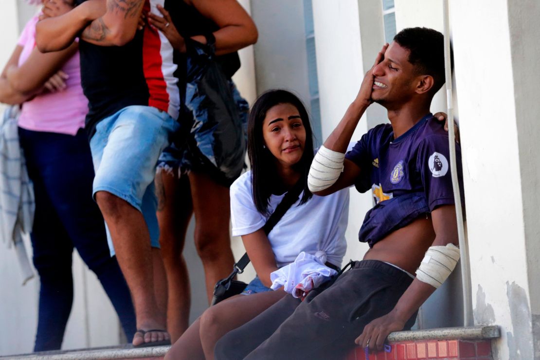 An injured person cries after being treated at Getulio Vargas Hospital after a police raid in Vila Cruzeiro, Rio de Janeiro, on Tuesday.