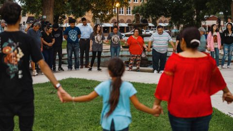 Members of the community gather at the City of Uvalde Town Square for a prayer vigil in the wake of a mass shooting at Robb Elementary School on Tuesday.