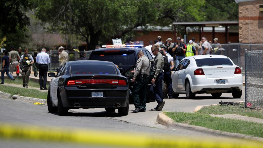 Law enforcement officers guard the scene of a shooting at Robb Elementary School in Uvalde, Texas, U.S. May 24, 2022. REUTERS/Marco Bello