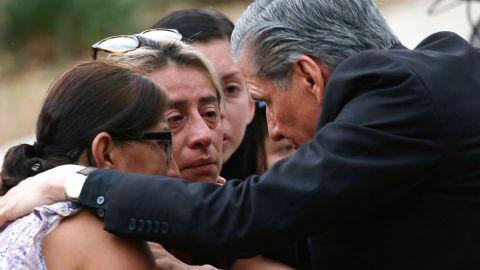 The archbishop of San Antonio, Gustavo Garcia-Siller, comforts families Tuesday outside the civic center after the deadly shooting at Robb Elementary School in Uvalde, Texas.