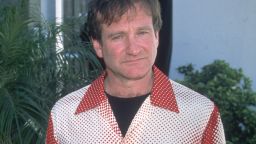 American actor and comedian Robin Williams, wearing a Jean Paul Gaultier shirt with a print of a muscular chest and abdomen, at an unspecified event, March 1996.
