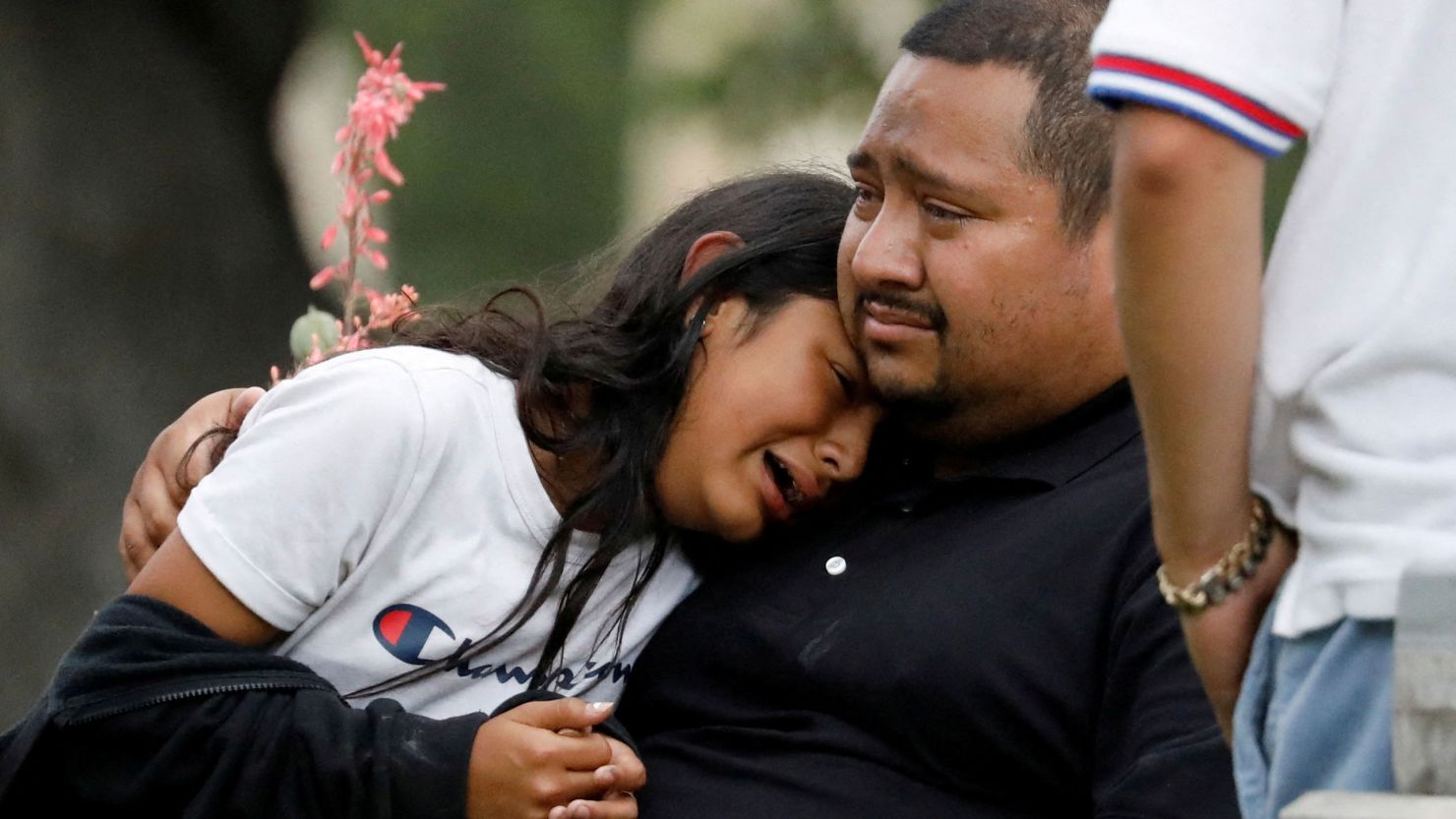 Families gather outside the civic center where students were transported after the elementary school shootings in Uvalde, Texas.  