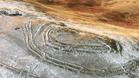 Earthworks can be seen at the Woden Law hill fort in southern Scotland, close to a Roman road, with the remains of Roman camps less than a mile away.