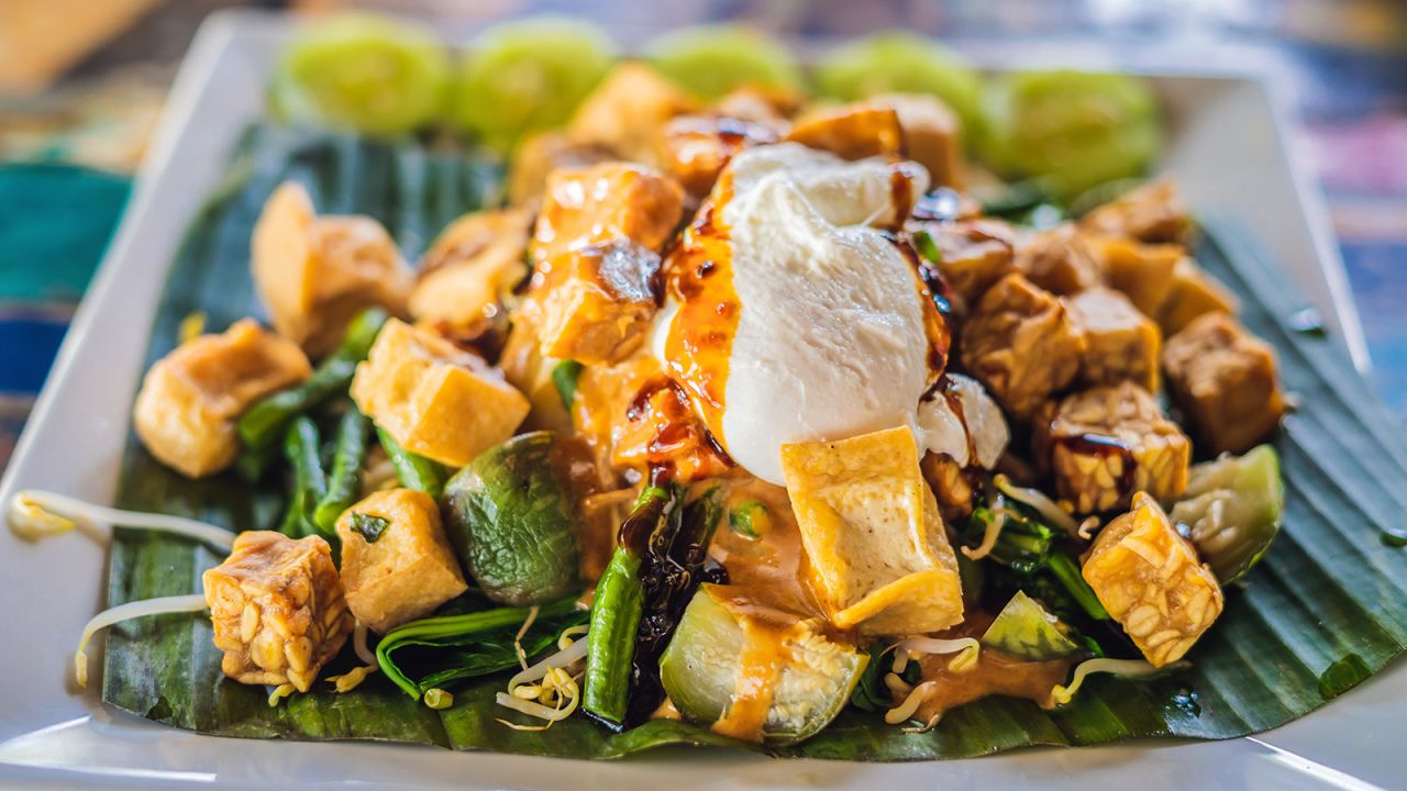 <strong>Gado gado, Indonesia: </strong>Meaning "mix-mix,"  gado gado tosses together a garden of vegetables and tasty ingredients in a thick, peanutty sauce. These can often include green beans, cabbage, carrots, bean sprouts, lettuce, tofu, cucumbers, tempeh, potatoes and egg. 