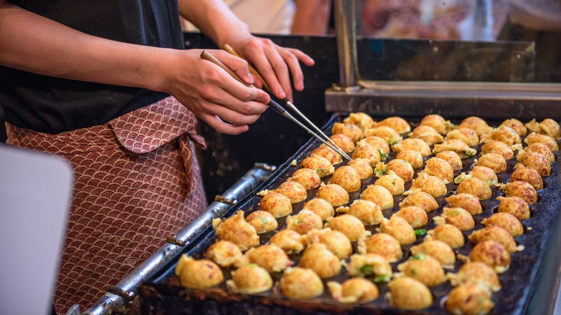 <strong>Takoyaki, Japan: </strong>To make Japan's famous takoyaki (octopus balls), vendors whip up the batter, pour it into a special iron and evenly disperse the fillings (diced octopus, spring onion, tempura flakes). Once ready, a drizzle of Japanese mayonnaise, takoyaki sauce, seaweed flakes and bonito (fish flakes) adds texture and flavor.