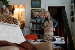 Nancy Rose, who contracted Covid-19 in 2021 and continues to exhibit long-haul symptoms including brain fog and memory difficulties, pauses while organizing her desk space on January 25, in Port Jefferson, New York.