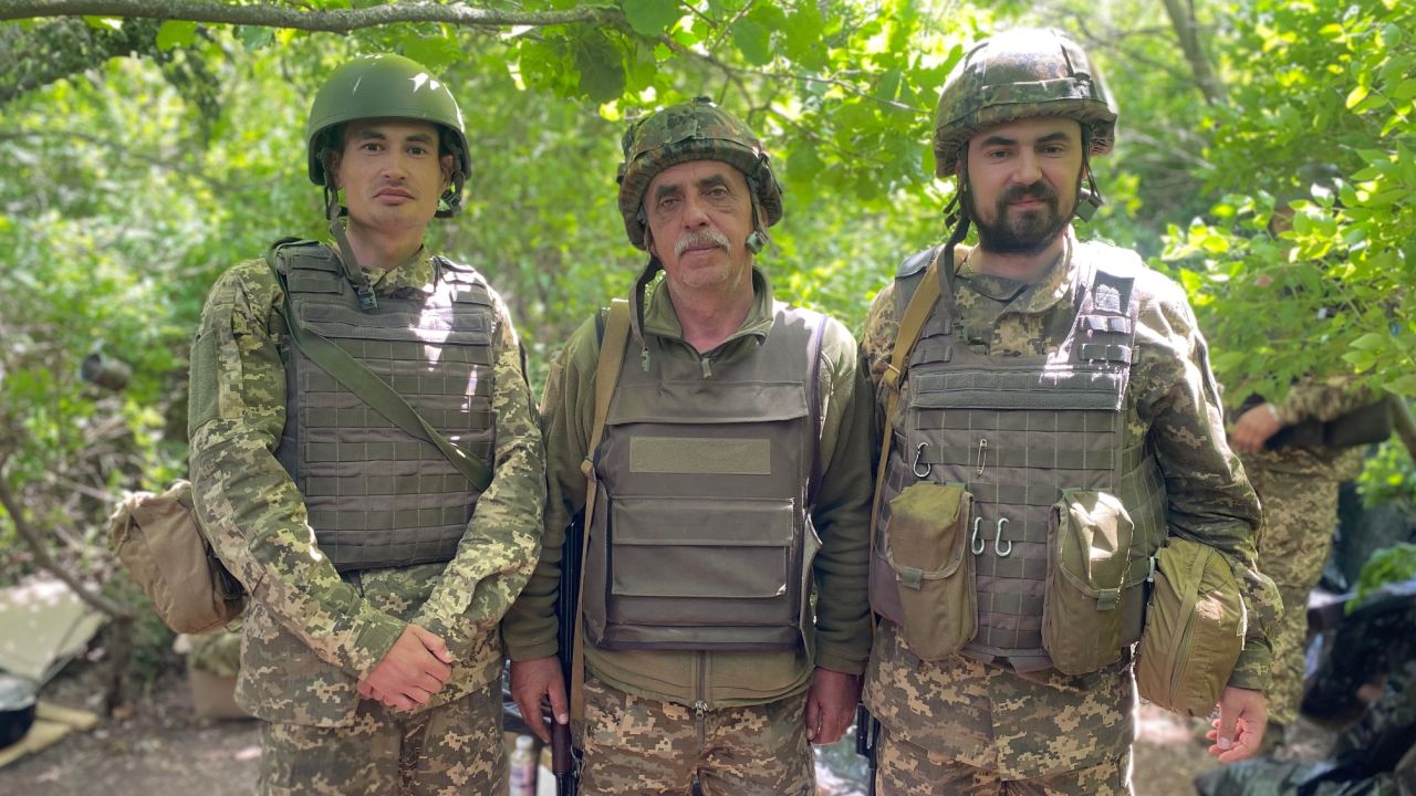 Yaroslav, center, signed up to fight alongside his sons -- Pavlo, left, and Nazar.