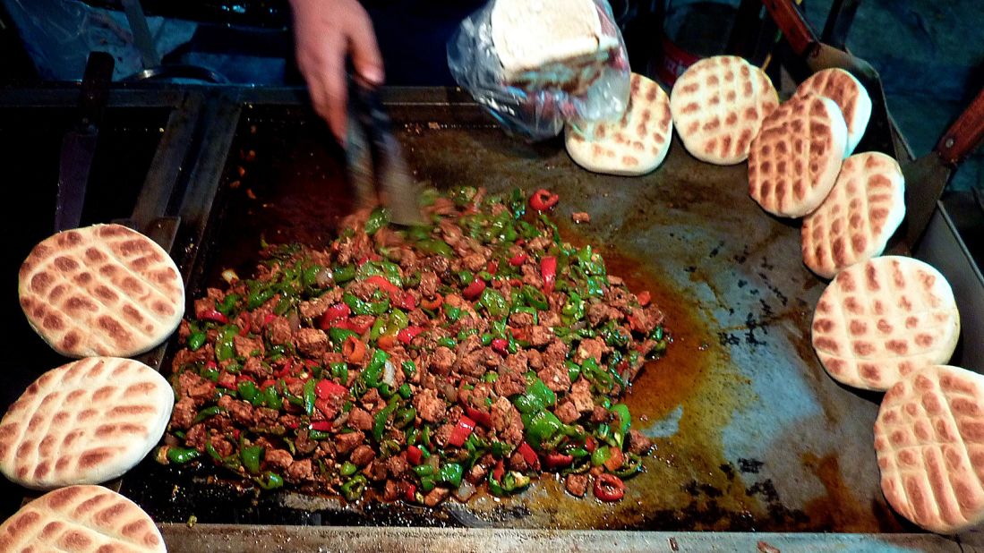 <strong>Rou jia mo, China: </strong>This dense, chewy mo (bun), is stuffed with a mountain of pork belly braised in soy sauce, rock sugar, herbs, plus a dozen or so spices (think cardamom, Sichuan peppercorns, cloves, bay leaf and star anise).