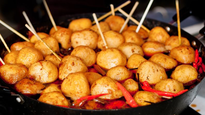 <strong>Curry fish balls, Hong Kong: </strong>Simmered in curry sauce, garlic, ginger, sugar and chili, these street snacks are known for their rich, robust flavor.