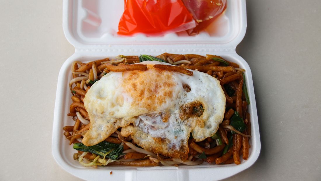 <strong>Lort cha, Cambodia: </strong>Typically prepared in street carts and markets, lort cha features short and squat rice pin noodles tossed with spring onions, Chinese broccoli, crunchy bean sprouts, chives, garlic and beef then topped with a fried egg and a special sauce.