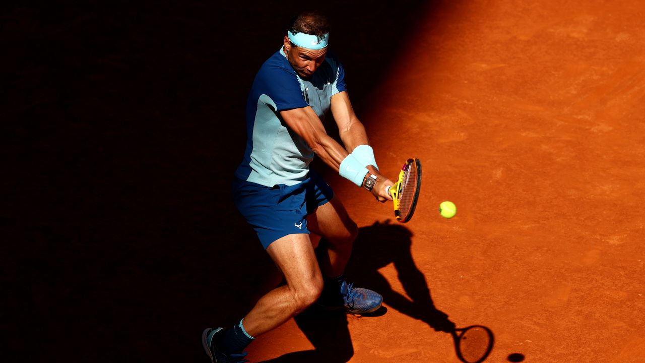 Rafael Nadal hits a backhand in his marathon third-round match against David Goffin of Belgium at the Madrid Open on May 5, 2022.