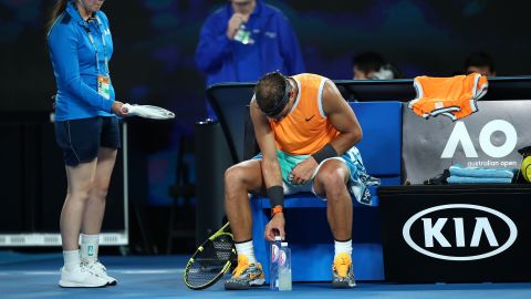 Rafael Nadal  adjusts a water bottle during his quarterfinal match against Frances Tiafoe of the United States at the 2019 Australian Open in Melbourne.