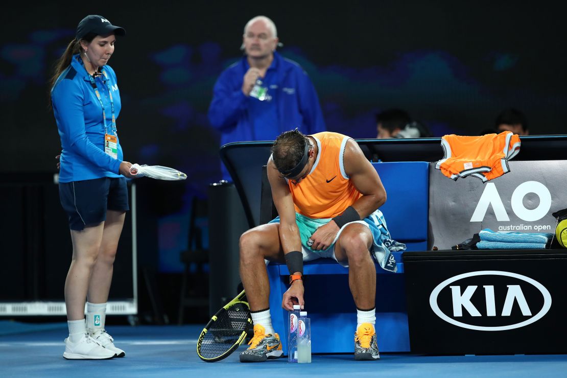 Rafael Nadal  adjusts a water bottle during his quarterfinal match against Frances Tiafoe of the United States at the 2019 Australian Open in Melbourne.