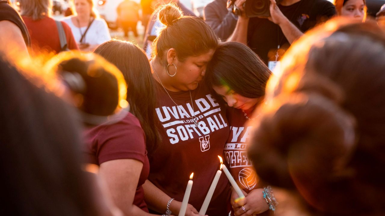 Attendees light candles during a memorial on May 25 held for the 19 children and two teachers who were killed by an 18-year-old gunman at Robb Elementary School the day before.