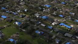 Blue tarps cover the roofs of homes, which were damaged after Hurricane Laura and Hurricane Delta landed in southwest Louisiana in Lake Charles, Louisiana on October 11, 2020.