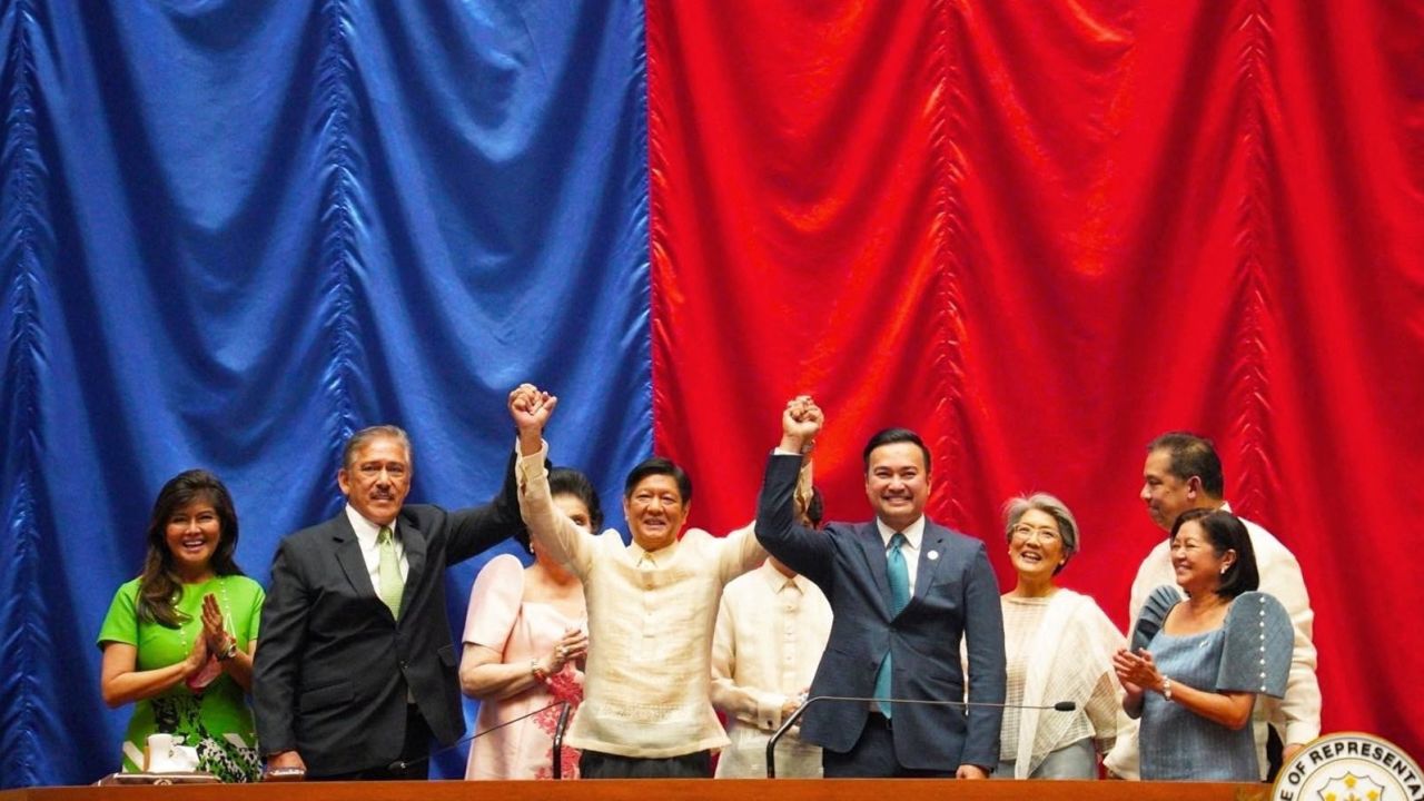 Ferdinand "Bongbong" Marcos Jr. raises hands with Senate President Vicente Sotto III and House Speaker Lord Allan Velasco during his proclamation, at the House of Representatives, in Quezon City, Metro Manila, Philippines, May 25, 2022.  